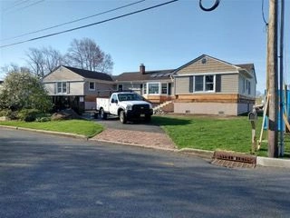 Suburban home with green lawn