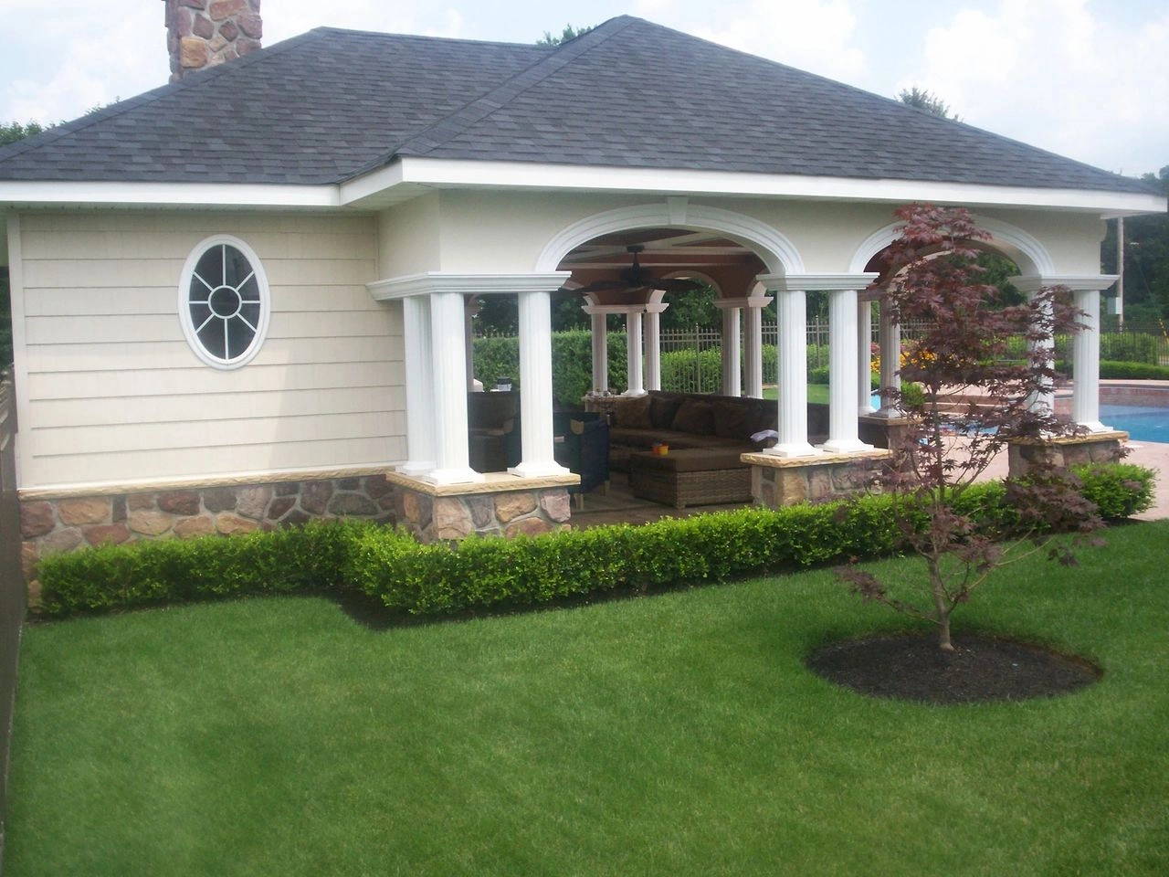 Backyard pavilion with stone and columns