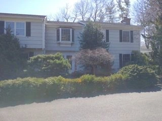 Suburban home with white siding
