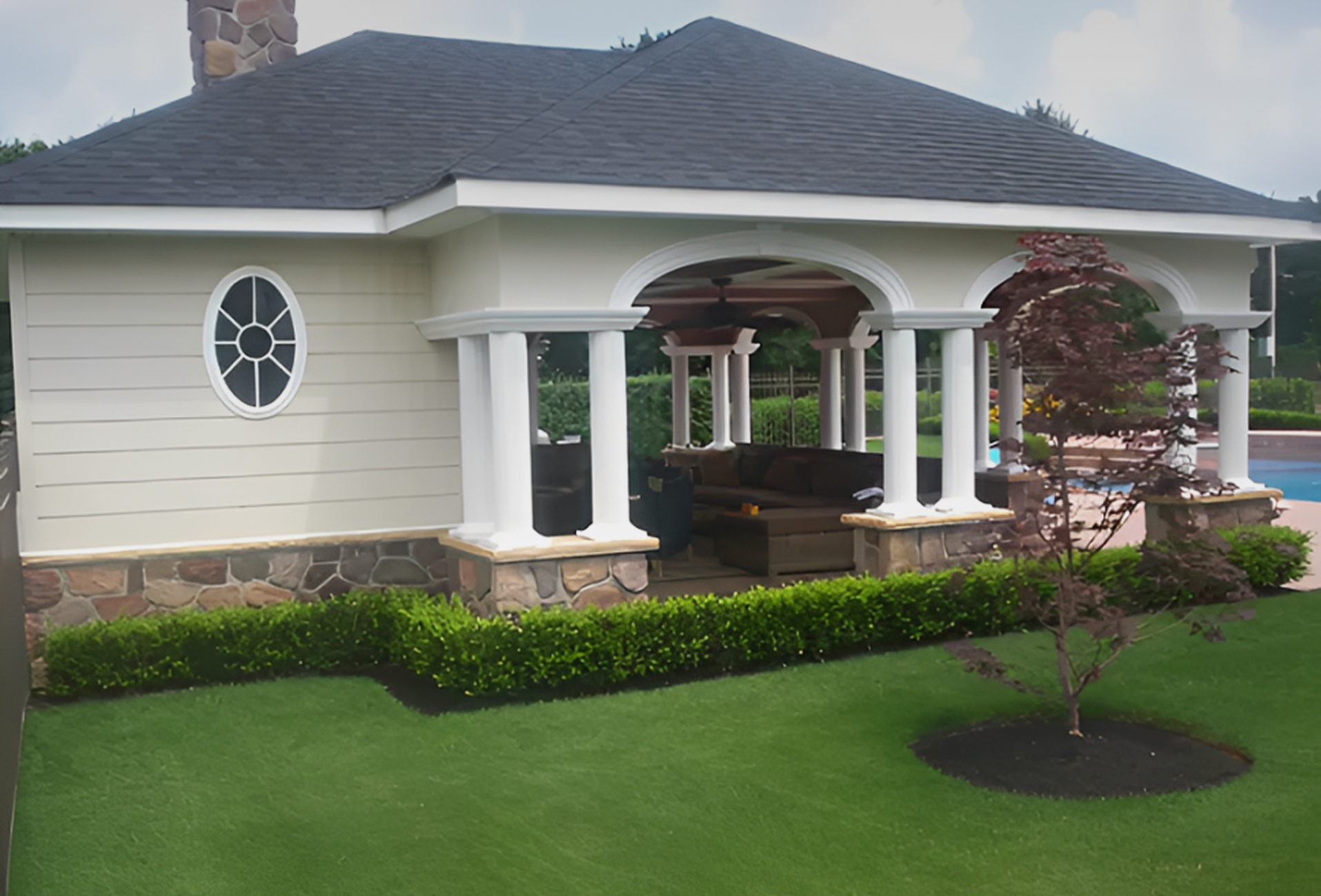 Backyard pavilion beside a pool